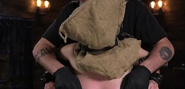  Slave with bag on a head in device bondage
